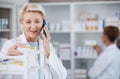 Pharmacy medicine, pharmacist phone call and woman talking in drugstore for telehealth. Healthcare, smartphone and happy