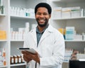 Pharmacy portrait, pharmacist man and tablet in medicine management, stock research or inventory shelf. Digital Royalty Free Stock Photo