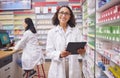 Pharmacy portrait, pharmacist woman and tablet for medicine management, stock research and inventory shelf. Digital Royalty Free Stock Photo