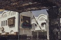 Pharmacy sign on white building in marsa alam, egypt, seen through reed fencing