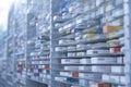 A pharmacy storage room ,Drugs are arranging and stored on a glass shelf in a pharmacy.taken out with a robot hand