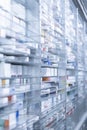 A pharmacy storage room ,Drugs are arranging and stored on a glass shelf in a pharmacy.taken out with a robot hand