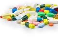 Pharmacy theme. Multicolored Isolated Pills and Capsules on the White Surface.