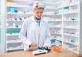 Pharmacy woman, pills and counting in store for stock, product and medicine for health on table with tools. Pharmacist