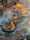 Candles burn on the stone floor of ancient Dakshinkali Hindu temple in Pharping, Nepal.