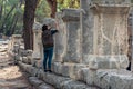 Archaeologist restores an ancient inscription on a column in Phaselis, Turkey