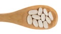 Grains over wooden bamboo spoon. Isolated, White background. Royalty Free Stock Photo