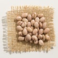 Pinto Bean legume. Close up of grains over burlap. Royalty Free Stock Photo