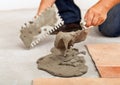Phases of installing ceramic floor tiles - apply the adhesive Royalty Free Stock Photo