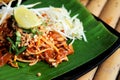 Phat thaior Pad thai is a famous Thailand tradition cuisine with fried noodle served on banana leaf Royalty Free Stock Photo