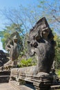 Serpent-like snake creature Phaya Naga statue in khmer ruins wat Royalty Free Stock Photo