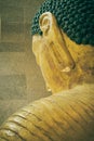 Portrait Back of Gold Buddha Reclining Statue in Vintage Tone