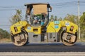 Zoom Side View Worker and Road Roller on Asphalt Road