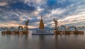 PHAYAO,THAILAND-NOVEMBER 12,2020:Naga statue with bright sky, clouds, mountains background and fresh water lake Kwan Phayao, one