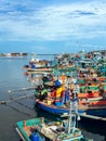 PHETCHABURI-THAILAND, AUGUST 20, 2022 : Beautiful scenic of variety colorful fishing boats at pier with seaview in evening at Phoo Royalty Free Stock Photo