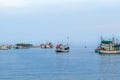 PHETCHABURI-THAILAND,OCTOBER 23, 2022 : Beautiful scenic of variety colorful fishing boats at pier with seaview in evening at Phoo