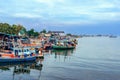 PHETCHABURI-THAILAND,OCTOBER 23, 2022 : Beautiful scenic of variety colorful fishing boats at pier with seaview in evening at Phoo Royalty Free Stock Photo