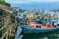 PHETCHABURI-THAILAND,OCTOBER 23, 2022 : Beautiful scenic of variety colorful fishing boats at pier with seaview in evening at Phoo Royalty Free Stock Photo