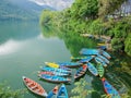 Phewa Lake in Pokhara city with boats in-shore, Nepal Royalty Free Stock Photo