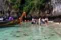 Phi Phi Island, Thailand - November 24 2019: Tourists enjoying their visit to the Monkey Beach on Phi Phi Island. Monkey beach is Royalty Free Stock Photo