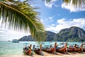 Phi Phi Island,  Thailand - November 26 2019: traditional wooden longtail boats parked at a beach in Phi Phi Island. Clear water Royalty Free Stock Photo