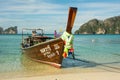 PHI-PHI, THAILAND - APRIL 30, 2017 : Taxi long-tail boat docked on the tropic beach