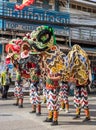 Thai teenagers perform a beautiful lion head puppet show at the annual carnival .