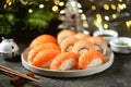 Philadelphia homemade sushi rolls and nigiri sushi with wild salmon, christmas background.