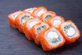 Philadelphia Maki Sushi made of Fresh Raw Salmon Cream Cheese and Cucumber. Traditional Japanese food - sushi rolls on white Royalty Free Stock Photo