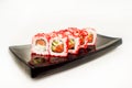 Philadelphia Maki Sushi - Roll with smoked salmon, cream cheese, shrimp, cucumber inside. Royalty Free Stock Photo