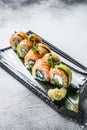 Philadelphia maki sushi with salmon, prawn, avocado, cream cheese. Sushi roll menu. White background. Top view Royalty Free Stock Photo