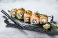 Philadelphia maki sushi with salmon, prawn, avocado, cream cheese. Sushi roll menu. White background. Top view Royalty Free Stock Photo