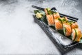 Philadelphia maki sushi with salmon, prawn, avocado, cream cheese. Sushi roll menu. White background. Top view. Copy space Royalty Free Stock Photo