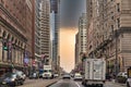 Philadelphia, PA - March 26 2021: Street view of downtown Philadelphia. Cars on the street and buildings along on a stormy day Royalty Free Stock Photo