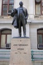 Statue of John Wanamaker who was the postmaster general in front of the Philadelphia City Hall building