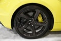 Philadelphia, Pennsylvania, U.S - January 14, 2024 - The black alloy wheel on the yellow color of the new 2024 Chevrolet Corvette Royalty Free Stock Photo