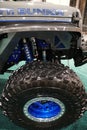 Philadelphia, Pennsylvania, U.S - January 14, 2024 - The custom made off-road blue wheel and large tire of the Jeep Wrangler