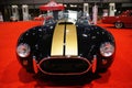 Philadelphia, Pennsylvania, U.S - January 14, 2024 - The 1965 Ford Era Cobra 427 2-door convertible in black and golden stripes