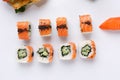 Philadelphia roll with cucumberon and appetizing fresh sushi white background. Sushi menu. Japanese food