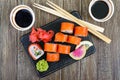 Philadelphia roll sushi with salmon, prawn, avocado, cream cheese served on wooden background Royalty Free Stock Photo