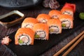 Philadelphia roll sushi with salmon, prawn, avocado, cream cheese. Sushi menu. Royalty Free Stock Photo