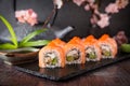 Philadelphia roll sushi with salmon, smoked eel, cucumber, avocado, cream cheese, red caviar. Sushi menu Royalty Free Stock Photo