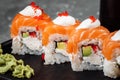 Philadelphia roll sushi with salmon, smoked eel, cucumber, avocado, cream cheese, red caviar. Sushi menu. Japanese food Royalty Free Stock Photo