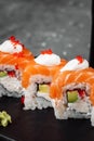 Philadelphia roll sushi with salmon, smoked eel, cucumber, avocado, cream cheese, red caviar. Sushi menu. Japanese food Royalty Free Stock Photo