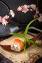 Philadelphia roll sushi with salmon, smoked eel, cucumber, avocado, cream cheese, red caviar. Sushi menu Royalty Free Stock Photo