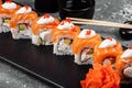 Philadelphia roll sushi with salmon, smoked eel, cucumber, avocado, cream cheese, red caviar. Sushi menu. Japanese food Royalty Free Stock Photo