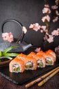 Philadelphia roll sushi with salmon, smoked eel, cucumber, avocado, cream cheese, red caviar. Sushi menu Royalty Free Stock Photo