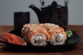 Philadelphia Sushi Roll ,California rolls with ginger and wasabi on black plate Royalty Free Stock Photo
