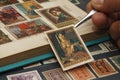 Philatelist looks at postage stamps