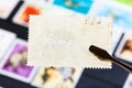 tongs keeps postage stamp with bad glue back side Royalty Free Stock Photo